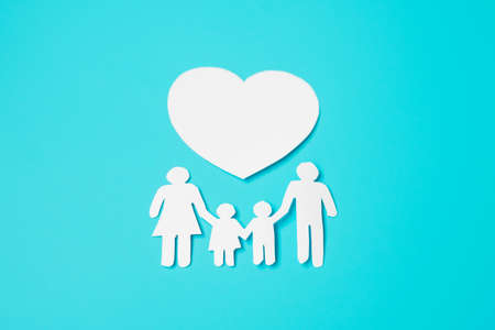 Happy Family day. paper shape cutout with Father, Mother, Children and heart. international day of families, Warm home, love, Foster, Insurance, Charity and Donation concepts.の写真素材