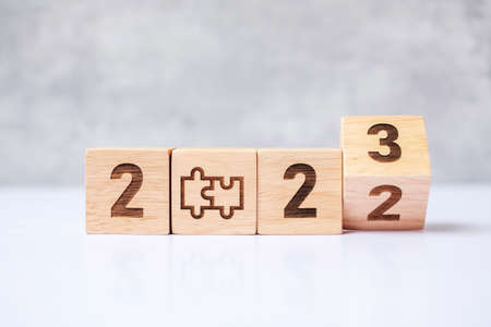 flip 2022 to 2023 block with jigsaw puzzle icon. Business Process, Team, teamwork, Goal, mission, Resolution, strategy, plan, Action, partnership, cooperation , brainstorm and New Year startの写真素材