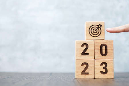 2023 block with dartboard sign. Business Goal, Target, Resolution, strategy, plan, Action...