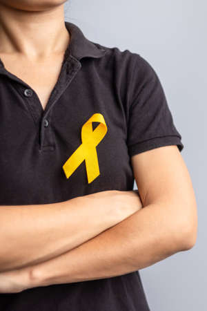 Suicide prevention day, Childhood, Sarcoma, bone and bladder cancer Awareness month, Yellow Ribbon for supporting people life and illness. children Healthcare and World cancer day conceptの写真素材