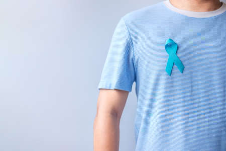Blue November Prostate Cancer Awareness month, Man in blue shirt with Blue Ribbon for support people...