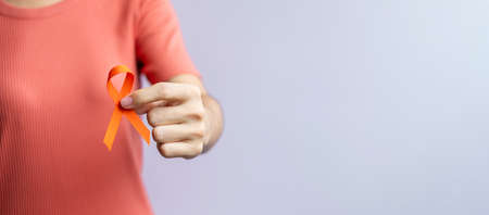 Orange Ribbon for Leukemia, Kidney cancer day, world Multiple Sclerosis, CRPS, Self Injury Awareness month. Healthcare and word cancer day conceptの写真素材