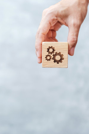 hand hold gear block with business goal, strategy, teamwork, target, mission, action, objective, brainstorming  and success conceptの写真素材