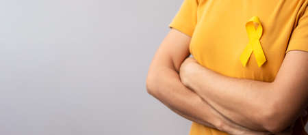Yellow September, Suicide prevention day, Childhood, Sarcoma, bone and bladder cancer Awareness month, Yellow Ribbon for supporting people life and illness. Healthcare and World cancer day conceptの写真素材