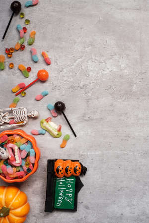 Happy Halloween day with ghost candies, pumpkin,  bowl and decorative. Trick or Threat, Hello October, fall autumn, Festive, party and holiday conceptの写真素材