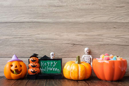 Happy Halloween day with ghost candies, pumpkin,  bowl and decorative. Trick or Threat, Hello October, fall autumn, Festive, party and holiday conceptの写真素材