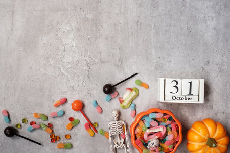 Happy Halloween day with ghost candies, pumpkin,  bowl and 31 October calendar. Trick or Threat, Hello October, fall autumn, Festive, party and holiday conceptの写真素材