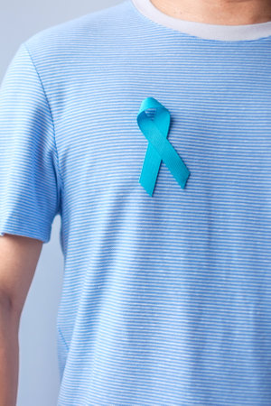 Blue November Prostate Cancer Awareness month, Man in blue shirt with Blue Ribbon for support people...
