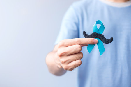 November Prostate Cancer Awareness month, Blue Ribbon with mustache for supporting people living and illness. Healthcare, International men, Father and World cancer day conceptの写真素材