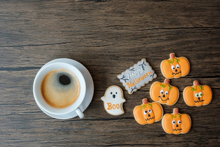 coffee cup and  funny Halloween Cookies. Happy Halloween day, Trick or Threat, Hello October, fall autumn, Traditional, party and holiday conceptの写真素材