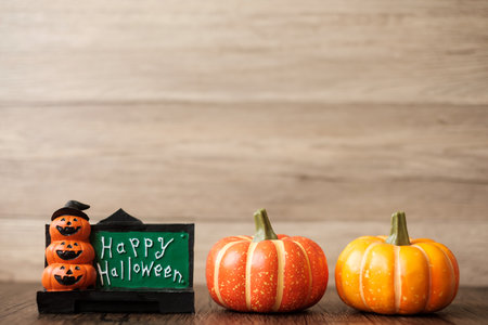 Orange pumpkin on table with copy space for banner background. Happy Halloween day, Hello October, fall autumn season, Festive, party and holiday conceptの写真素材