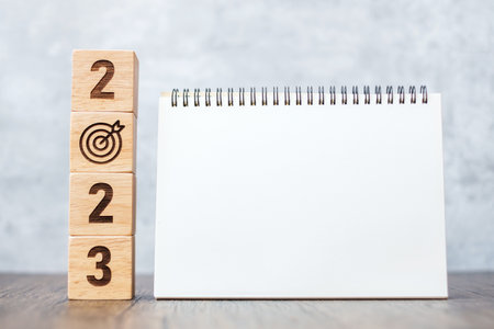 2023 Happy New Year with blank notebook and wooden number. countdown, Resolution, Goals, Plan, Action and Mission Conceptの写真素材