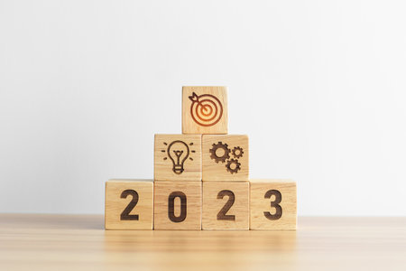2023 wood block with business goal, plan. Action strategy, target, mission, teamwork, idea and New Year start conceptの写真素材