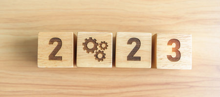 2023 block with gear icon. Business Process, Team, teamwork, Goal, Target, Resolution, strategy,...