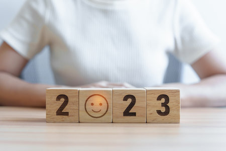 Smile face with 2023 block.  Satisfaction, feedback, Review, mental health, eco sustainable and Happy New Year conceptの写真素材