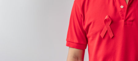 Red Ribbon for December World Aids Day, acquired immune deficiency syndrome, multiple myeloma Cancer Awareness month and National Red ribbon week. Healthcare and world cancer day conceptの写真素材