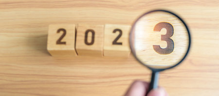 2023 block with magnifying glass. SEO, Search Engine Optimization, hiring , Advertising, Idea,...