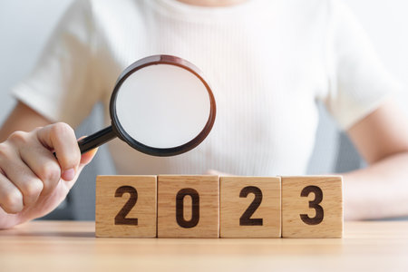 2023 block with magnifying glass. SEO, Search Engine Optimization, hiring , Advertising, Idea, Strategy, marketing, Keyword, Content and New Year start conceptsの写真素材