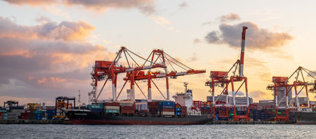 working crane and container Cargo ship of Logistics and transportation industry in Osaka city. Osaka, Kansai, Japan, 28 November 2019のeditorial素材