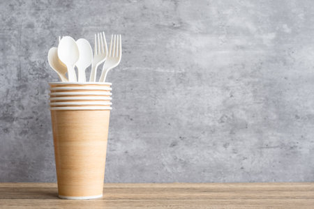 Eco friendly food packaging on table background. natural container: cup, plate, spoon and fork. zero waste, pollution, earth day, free plastic, world Environment day conceptの写真素材