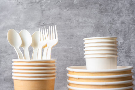 Eco friendly food packaging on table background. natural container: cup, plate, spoon and fork. zero waste, pollution, earth day, free plastic, world Environment day conceptの写真素材