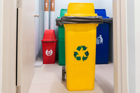 Yellow trash dustbin for Recyclable waste and Red, green and blue for Hazardous, Biodegradable and General waste. recycling management, waste segregation, garbage and rubbish conceptの写真素材