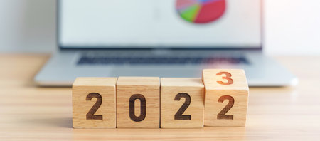 2023 Year block against computer laptop background. Goal, Target, Resolution, strategy, plan, finance, budget, motivation, and New Year start conceptsの写真素材
