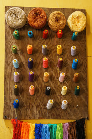 Colorful yarn on spool, thread on tube, cotton wool. Tailor concept