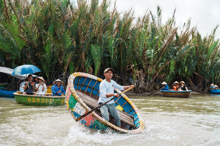 Fisherman showing spinning on basket boat, is a unique Vietnamese at Cam thanh village. Hoi An, Vietnam, 15 November 2022のeditorial素材