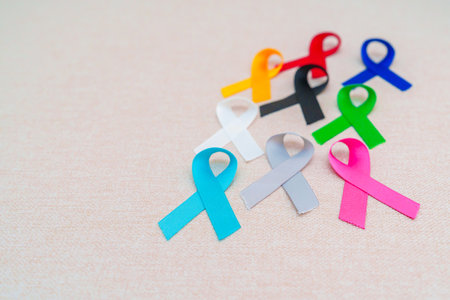 World cancer day, February 4. Colorful ribbons for supporting people living and illness. Healthcare,...