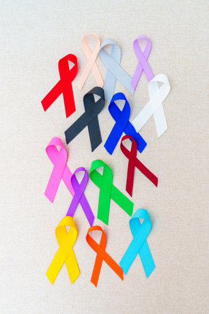 World cancer day, February 4. Colorful ribbons for supporting people living and illness. Healthcare, fighting, medical and National Cancer Survival day, Autism awareness day conceptの写真素材