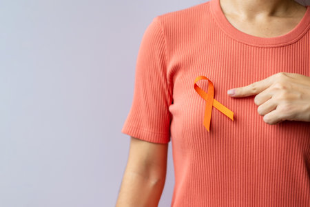 Orange Ribbon for Leukemia, Kidney cancer day, world Multiple Sclerosis, CRPS, Self Injury Awareness month. Healthcare and word cancer day conceptの写真素材
