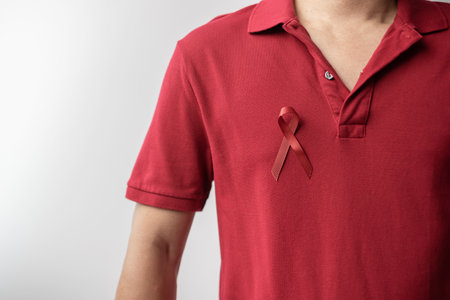 Burgundy Red Ribbon for March multiple myeloma Cancer and December World Aids Day Awareness month. Healthcare and world cancer day conceptの写真素材