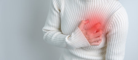woman hand holding chest ache. Heart disease, angina disease and symptom heart attack disease...