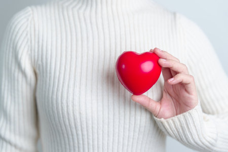 woman hand holding red heart shape. love, donor, world heart day, world health day and Insurance conceptsの写真素材