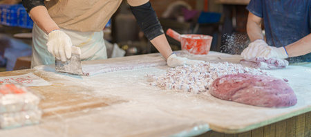 hand preparing Yu Yuan or Jiufen taro ball on the Jiufen Old Street. landmark and popular for...