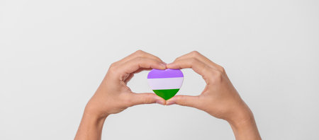 Queer Pride Day and LGBT pride month concept. purple, white and green heart shape for Lesbian, Gay, Bisexual, Transgender, genderqueer and Pansexual communityの写真素材