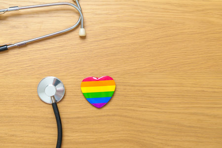 LGBT pride month concept or LGBTQ+ or LGBTQIA+. rainbow heart shape with Stethoscope for Lesbian, Gay, Bisexual, Transgender, Queer and Pansexual communityの写真素材