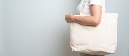 Woman with Eco Shopping tote bag with Copy space for text. Environmental Protection, Zero waste, Reusable, Say No Plastic, Sustainability, Eco Friendly, World Environment day and Earth day conceptの写真素材