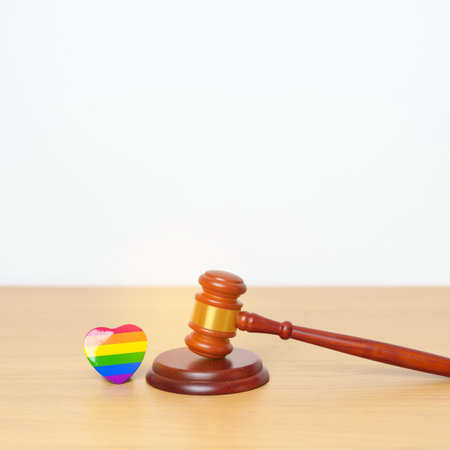 LGBT Law and Pride month concepts. gavel justice hammer with rainbow colorful heart shape for Lesbian, Gay, Bisexual, Transgender, Queer, Intersex, Asexual, Agender, Non Binary, Two Spirit, Pansexualの写真素材
