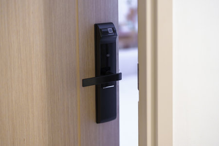 smart digital door lock while open or close the door at home or apartment. NFC Technology, Fingerprint scan, keycard, PIN number, smartphone, electrical and contactless lifestyle conceptsの写真素材