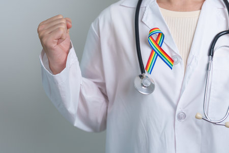Doctor with LGBTQ Rainbow ribbon for Support Lesbian, Gay, Bisexual, Transgender and Queer community and happy Pride month conceptの写真素材