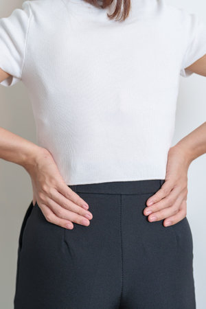 Woman having back pain. Urinary system and Stones, Cancer, world kidney day, Chronic kidney stomach, liver pain and pancreas conceptの写真素材
