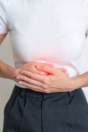 Woman having Stomach pain. Ovarian and Cervical cancer, Cervix disorder, Endometriosis, Hysterectomy, Uterine fibroids, Reproductive system, menstruation, diarrhea, digestive system and Pregnancyの写真素材