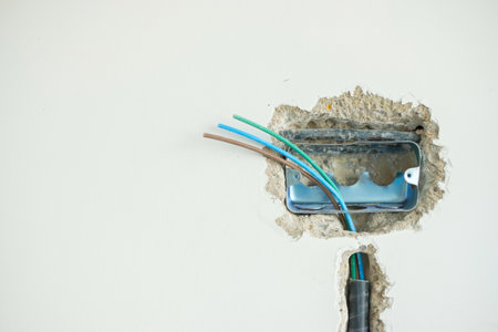 Electrical Wiring under plaster, hidden installation cables for socket to a concrete. Renovation, Repair and development of home and apartment conceptsの写真素材