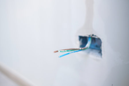 Electrical Wiring under plaster, hidden installation cables for socket to a concrete. Renovation,...