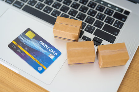 Boxes with credit card on a laptop computer. online shopping, Marketplace platform website,...