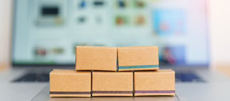 Boxes on laptop computer. online shopping, Marketplace platform website, technology, ecommerce, shipping delivery, logistics and online payment conceptsの写真素材