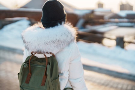 Woman tourist Visiting in Hakodate, Traveler in Sweater sightseeing Kanemori Red Brick Warehouse with Snow in winter. landmark and popular for attractions in Hokkaido,Japan.Travel and Vacation conceptの写真素材