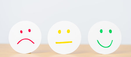 Emotion face paper, Mental health Assessment, Psychology, Health Wellness, Feedback, Customer Review, Experience, Satisfaction Survey, Opinion, Evaluation and World Mental Health dayの写真素材
